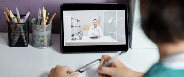 Nurse on ipad watching instructor